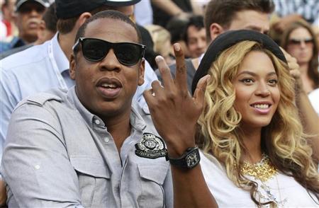 Rapper Jay-Z and his wife, singer Beyonce, attend the match between Novak Djokovic of Serbia and Rafael Nadal of Spain in the men's final of the U.S. Open tennis tournament in New York, September 12, 2011.