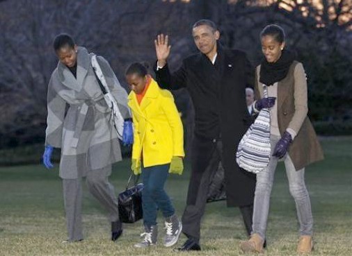 President Barack Obama, first lady Michelle Obama and their daughters Sasha and Malia arrive on the South Lawn of the White House, Tuesday, Jan. 3, 2012, in Washington. The first family was returning from their family vacation to Hawaii. (AP Photo/Haraz N. Ghanbari) 