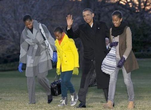 President Barack Obama, first lady Michelle Obama and their daughters Sasha and Malia arrive on the South Lawn of the White House, Tuesday, Jan. 3, 2012, in Washington. The first family was returning from their family vacation to Hawaii. (AP Photo/Haraz N. Ghanbari)