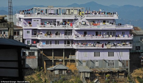 You treat this place like a hotel: With 100 rooms, the Ziona mansion is the biggest concrete structure in the hilly village of Baktawng in Mizoram, India