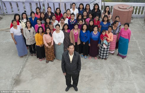 The wives and me: Mr Ziona Chana poses with his 39 wives at their home in Baktawng
