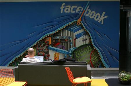 An employee works on a computer at the new headquarters of Facebook in Menlo Park
