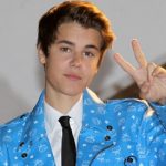 Canadian singer and actor Justin Bieber waves as he arrives to attend the annual NRJ Music Awards ceremony on January 28, 2012 in Cannes, French Riviera. AFP PHOTO VALERY HACHE (Photo credit should read VALERY HACHE/AFP/Getty Images)