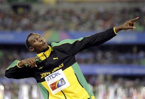 FILE - This Sept. 4, 2011 file photo shows Jamaica's Usain Bolt posing on the podium after the Jamaican team won the gold and set a new world record in the men's 4x100m relay final at the World Athletics Championships in Daegu, South Korea. Any talk of the Olympics has to start with the flashy Jamaican sprinter. His performance in Beijing four years ago was magical. (AP Photo/Martin Meissner, FIle)