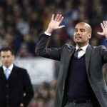 Barcelona's coach Pep Guardiola gestures after Lionel Messi's goal against Getafe during their Spanish first division soccer match at Nou Camp stadium in Barcelona April 10, 2012. REUTERS/Gustau Nacarino