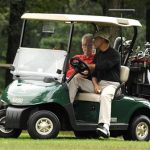 President Barack Obama takes the wheel of a golf cart as he rides with former President Bill Clinton as they play golf at Andrews Air Force Base, Maryland, September 24, 2011. REUTERS/Mike Theiler