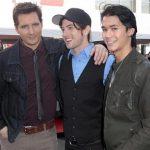 Actors Peter Facinelli (L-R), Jackson Rathbone and Booboo Stewart pose as several cast members visit fans camping out for the premiere of "The Twilight Saga: Breaking Dawn Part - 1" in Los Angeles, California November 13, 2011. REUTERS/Jason Redmond
