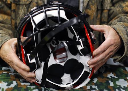 To match
Feature SPORTS/FOOTBALL-HELMETS/ A worker assembles
a Xenith football helmet at the company's facility in Lowell, Massachusetts March 26, 2012. REUTERS/Brian Snyder