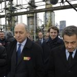 France's President Nicolas Sarkozy (R) walks with former Socialist Party prime minister Laurent Fabius (2ndL) at the oil refinery Petroplus in Petit-Couronne, near Rouen, northwestern France, February 24, 2012. REUTERS/Philippe Wojazer