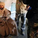 Saif al-Islam, the son of Libyan leader Muammar Gaddafi, is pictured sitting in a plane in Zintan after his capture in this November 19, 2011 file photo.REUTERS/Ismail Zitouny/Files