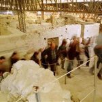 A group of journalists leave the archaeological site of prehistoric city of Akrotiri at the volcanic cycladic island of Santorini March 27, 2000. YK