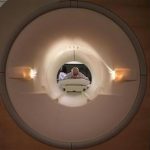 A cancer patient looks into the tube of a MRI scanner at a hospital in Washington May 23, 2007. REUTERS/Jim Bourg Photo