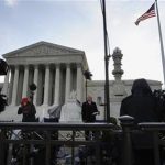 Television news networks report live on the sidewalk during the third and final day of legal arguments over the Patient Protection and Affordable Care Act at the Supreme Court in Washington, March 28, 2012. REUTERS/Jonathan Ernst
