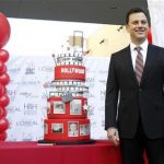 Television host Jimmy Kimmel poses next to a cake during a celebration for the 125th anniversary of the City of Hollywood in Hollywood, California February 1, 2012. REUTERS/Mario Anzuoni