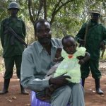 Lord's Resistance Army (LRA) leader Joseph Kony holds his daughter, and son during at peace negotiations between the LRA and Ugandan religious and cultural leaders in Ri-Kwangba, southern Sudan, November 30, 2008. REUTERS/Africa24 Media