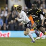 Tottenham Hotspur's Luka Modric (L) is chased by Bolton Wanderers' Fabrice Muamba during their English FA Cup quarter-final match, March 17, 2012. REUTERS/Suzanne Plunkett