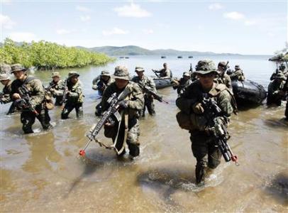 Philippine and
U.S. marine soldiers wade in shallow water in a bay during a amphibious raid as part of a Philippine-U.S. joint military
exercise in Ulugan bay Philippine and U.S. marine
soldiers wade in shallow water in a bay during a amphibious raid as part of a Philippine-U.S. joint military exercise in
Ulugan bay, western coast of Philippines April 25, 2012. REUTERS/Romeo Ranoco