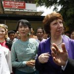 Myanmar's pro-democracy leader Aung San Suu Kyi (C) walks next to European Union Foreign Policy chief Catherine Ashton after their meeting and news conference in front of the National League for Democracy head office in Yangon April 28, 2012. REUTERS/Soe Zeya Tun