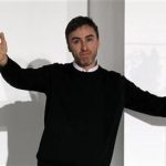 Belgian designer Raf Simons acknowledges audience applauses at the end of the Jil Sander 2012 Autumn/Winter collection show during Milan Fashion Week February 25, 2012. REUTERS/Alessandro Garofalo