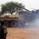 South Sudan's army, or the SPLA, soldiers load a Soviet-made T-72 tank into a truck in Halop, Unity state, April 24, 2012. REUTERS/Goran Tomasevic