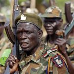 Soldiers of South Sudan's SPLA army shout at a military base in Bentiu April 22, 2012. REUTERS/Goran Tomasevic