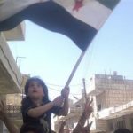 Demonstrators protest against Syria's President Bashar Al-Assad in Kafranbel, near Idlib April 8, 2012. REUTERS/Raad Al Fares/Shaam News Network/Handout