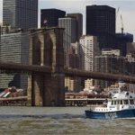 A New York Police Department patrol boat passes the Brooklyn Bridge as it patrols New York Harbor August 31, 2011. REUTERS/Lucas Jackson