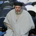 Muslim cleric Abu Hamza al-Masri leads prayers outside the North London Central Mosque in the Finsbury Park area of London in this January 24, 2003 file photograph. REUTERS/Toby Melville/Files