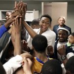 In this photo taken in Chicago on Tuesday, March 13, 2012, Jabari Parker celebrates with his Simeon Career Academy teammates after winning an Illinois state super sectional basketball playoff game. For all the attention Jabari gets, Simeon coach Robert Smith says: ?He doesn't want this to be about him. He wants it to be about the team.? (AP Photo/Charles Rex Arbogast)