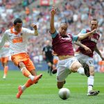 Rebecca Naden, PA/Associated Press - Blackpool? Thomas Ince, left, scores the equalising goal under pressure from West Ham? Winston Reid, with Matt Taylor, right, during their Football League Championship Final at Wembley Stadium in London, Saturday May 19, 2012.