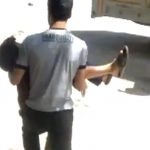Image made from amateur video released by Shaam News Network purports to show a wounded child being evacuated in Aleppo on May 25, 2012. See more images from the protests and crackdown in Syria.