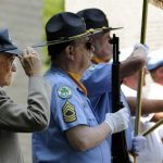 The wreath laying ceremony at Green Hill Park brought out more people than last year to honor Vietnam veterans. Lee F. Bartlett Jr., 93, at left, a veteran of World War II, salutes. (T&G Staff Photos/CHRISTINE PETERSON)