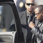 Bobby Brown (R) leaves the funeral service of ex-wife, pop singer Whitney Houston, at the New Hope Baptist Church in Newark, New Jersey February 18, 2012. REUTERS/Carlo Allegri