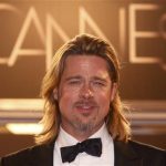 Cast member Brad Pitt poses on the red carpet after the screening of the film "Killing Them Softly", in competition at the 65th Cannes Film Festival, May 22, 2012. REUTERS/Christian Hartmann