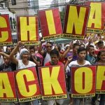 Demonstrators chant anti-China slogans as they march towards the Chinese consulate in protest over the Scarborough Shoal islands, in Manila's Makati financial district, in this May 11, 2012 file picture. REUTERS/Erik De Castro