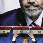 Mohamed Mursi, the head of the Muslim Brotherhood's political party and the Brotherhood's presidential candidate, waves to his supporters during a campaigning conference near Amr ibn al-Asin Mosque in old Cairo April 30, 2012. REUTERS/Amr Abdallah Dalsh