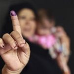 A woman shows her ink-stained finger after casting her vote at a polling station in Cairo May 24, 2012. REUTERS/Mohammed Salem
