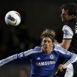 Chelsea's Fernando Torres (L) challenges Newcastle United's Mike Williamson during their English Premier League soccer match at Stamford Bridge in London May 2, 2012. REUTERS/Stefan Wermuth