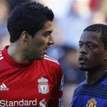 Liverpool's Luis Suarez and Manchester United's Patrice Evra confront each other during their English Premier League match at Anfield, October 15, 2011. REUTERS/Phil Noble