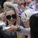 Singer Lady Gaga poses for a photograph with a fan upon her arrival at Narita international airport in Narita, east of Tokyo May 8, 2012. REUTERS/Toru Hanai