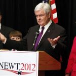Former Speaker of the House Newt Gingrich stands next to his wife, Callista (R), son-in-law Jimmy Cushman and grandson Robert (2nd L) as he drops out of the race for the GOP presidential nomination while in Arlington, Virginia, May 2, 2012. REUTERS/Larry Downing