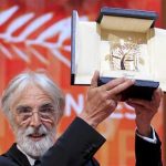 Director Michael Haneke reacts after receiving the Palme d'Or award for the film "Amour" (Love) during the awards ceremony of the 65th Cannes Film Festival, May 27, 2012. REUTERS/Yves Herman