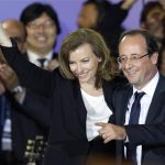 France's newly-elected President Francois Hollande (R) and his companion Valerie Trierweiler celebrate on stage during a victory rally at Place de la Bastille in Paris early May 7, 2012. France voted in elections on Sunday and Francois Hollande becomes the nation's first Socialist president in 17 years. REUTERS/Charles Platiau (FRANCE - Tags: POLITICS ELECTIONS)