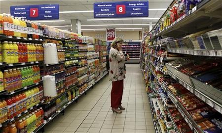 A shopper is seen at a branch of South African retailer Pick n Pay in Johannesburg A branch of South African retailer Pick
n Pay in Johannesburg, October 20, 2010. REUTERS/Siphiwe Sibeko