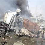 Mangled and smouldering vehicles are seen at the site of an explosion in Damascus May 10, 2012. REUTERS/Sana/Handout