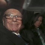 Rupert Murdoch, with his wife Wendi, is driven away after giving evidence to the Leveson Inquiry in the High Court in central London April 25, 2012. REUTERS/Suzanne Plunkett