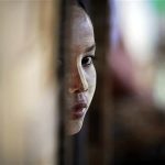 27 year-old HIV-positive Zinmar Nwe, whose husband died of AIDS, looks from inside her hut at the HIV/AIDS hospice founded by a member of the National League for Democracy (NLD) party in the suburbs of Yangon May 26, 2012. REUTERS/Damir Sagolj