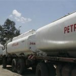 Trucks transporting oil, petrol and gas wait to reload outside a depot in the outskirts of Nairobi, Kenya, September 30, 2008. REUTERS/Antony Njuguna