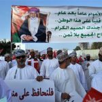 Demonstrators carry banners during a march against the unrest which took place in neighboring city Sohar and expressing support for ruler Sultan Qaboos bin Said, in Muscat in this March 1, 2011 file photo.REUTERS/Sultan Al Hasani/Files
