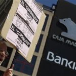 A man shouts slogans during a protest outside headquarters of Spain's fourth largest bank Bankia in Madrid May 24, 2012. REUTERS/Sergio Perez